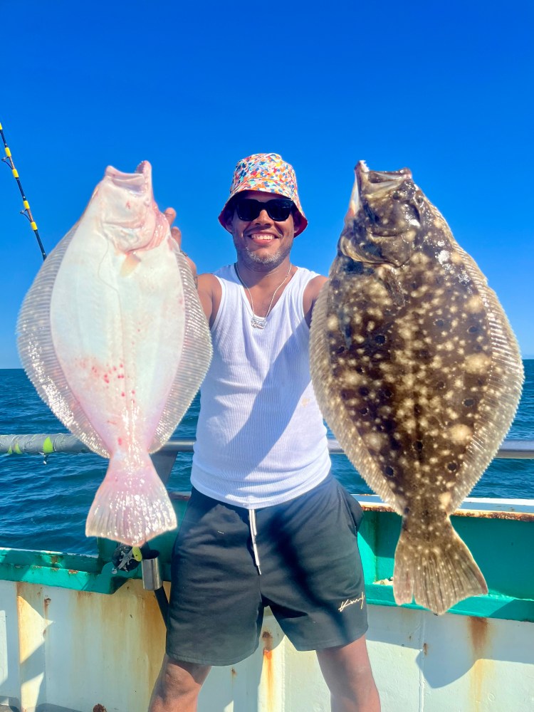 a person holding a fish