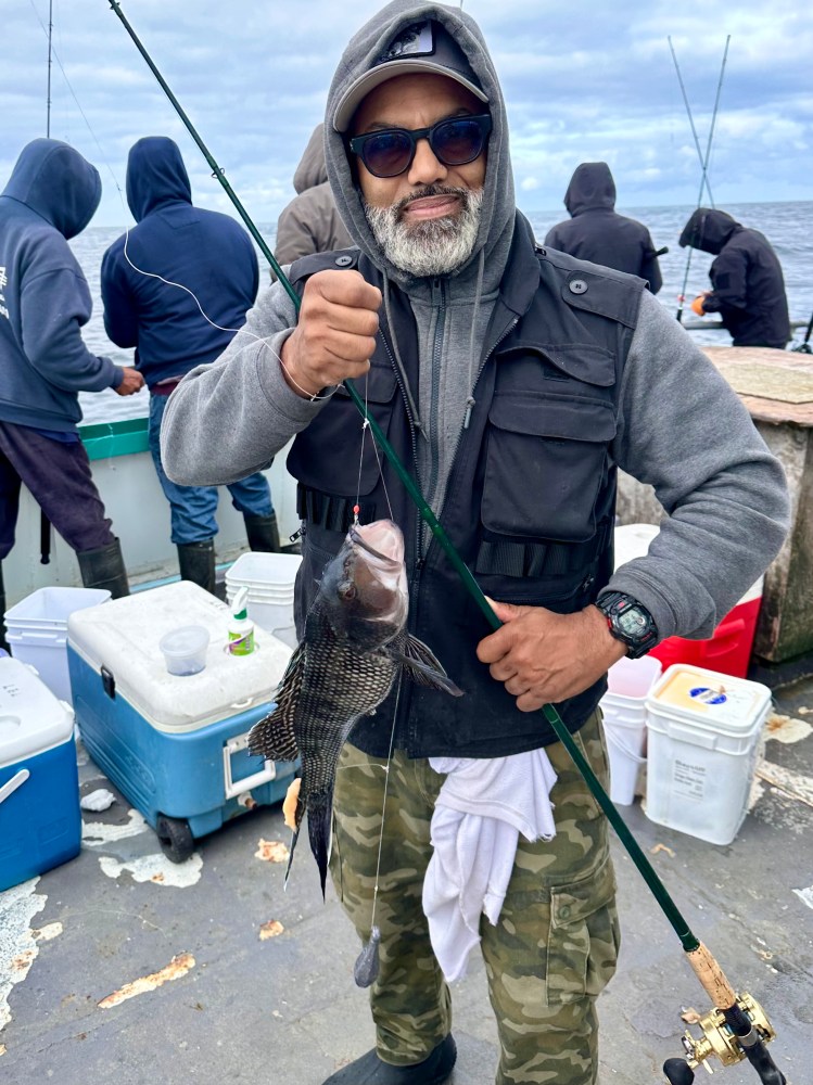 a man holding a fish