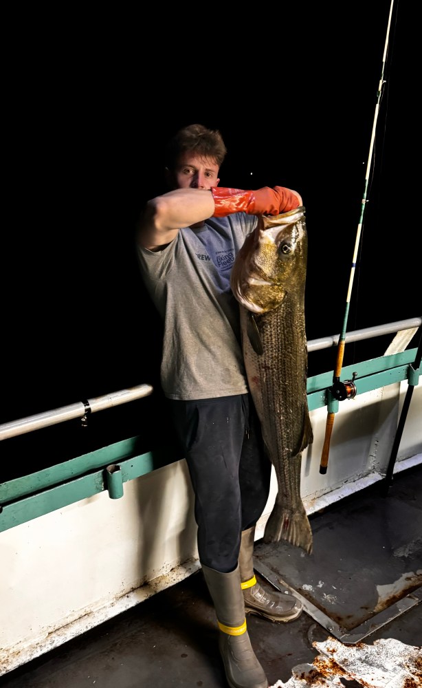 a man holding a fish