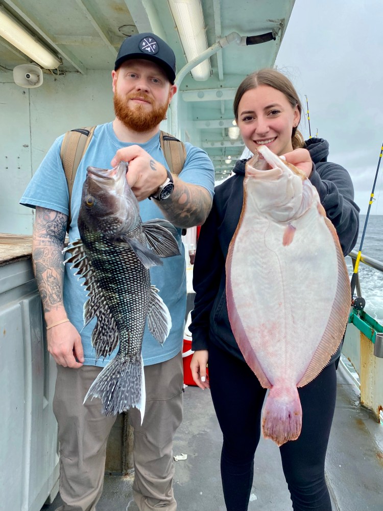 a person holding a fish