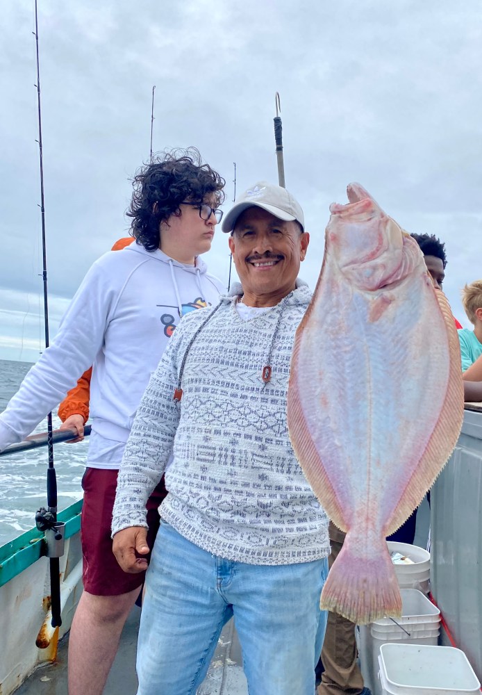 a person holding a fish