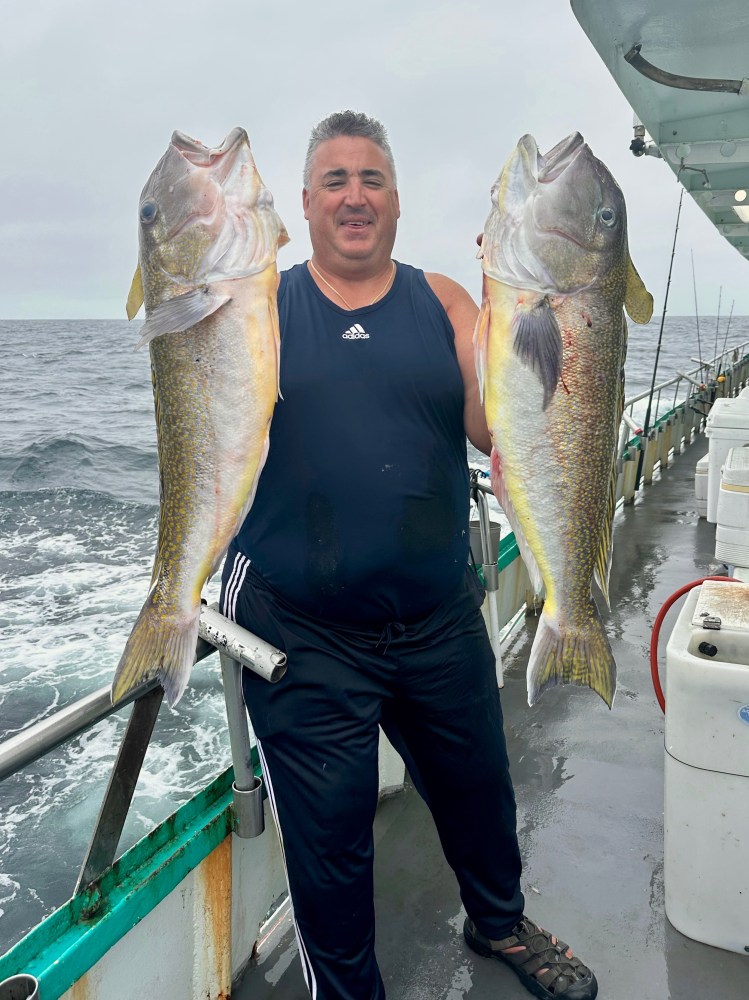 a man holding a fish