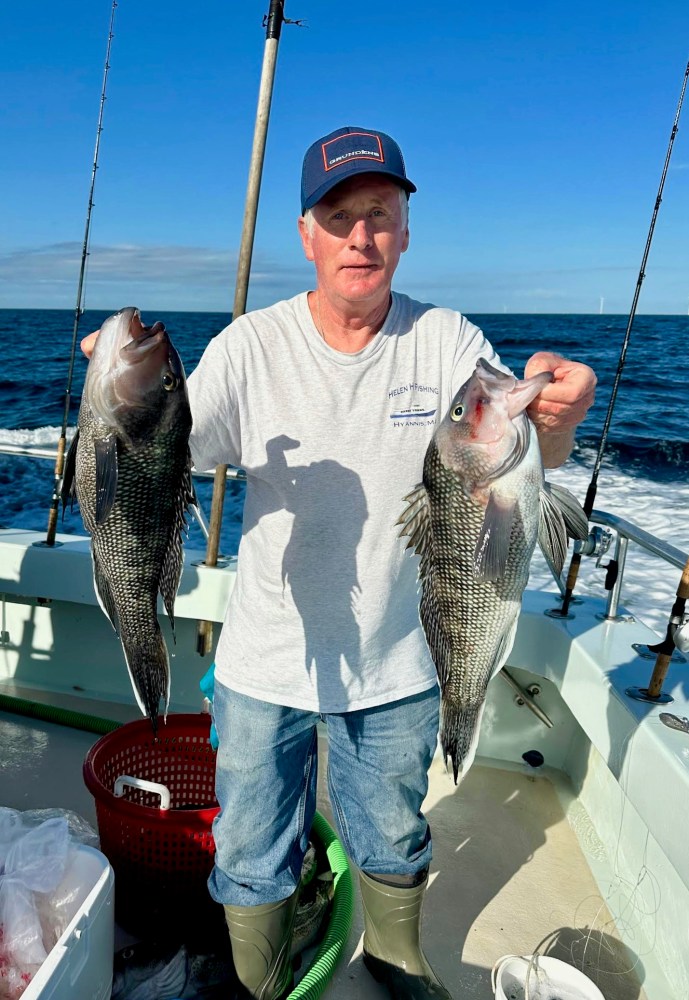 a man holding a fish