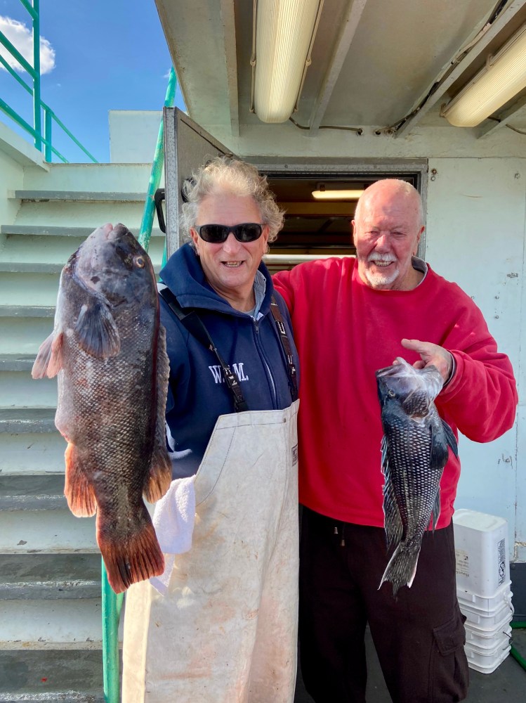 a man holding a fish