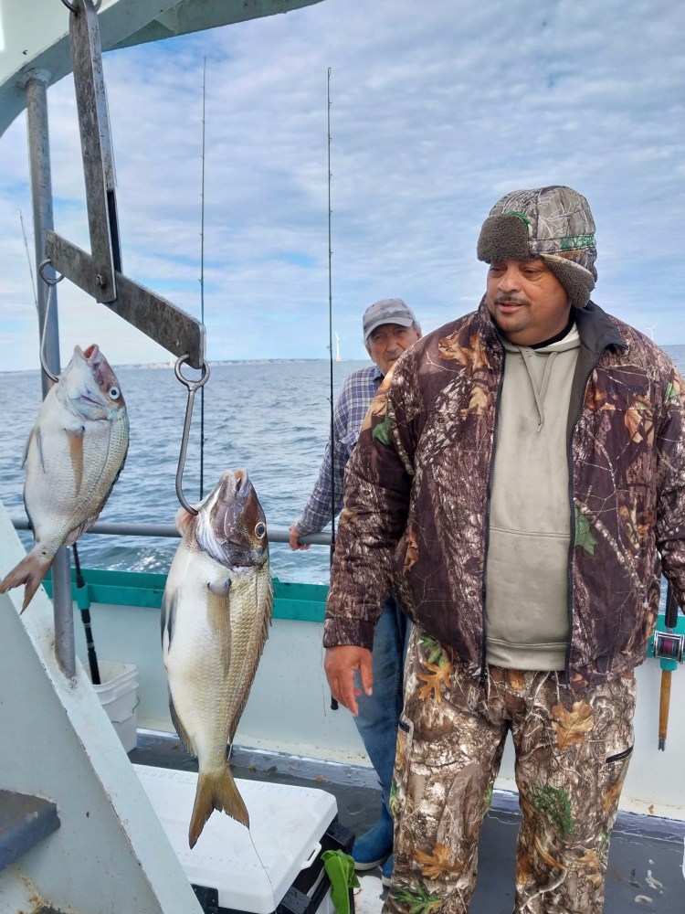 a person holding a fish