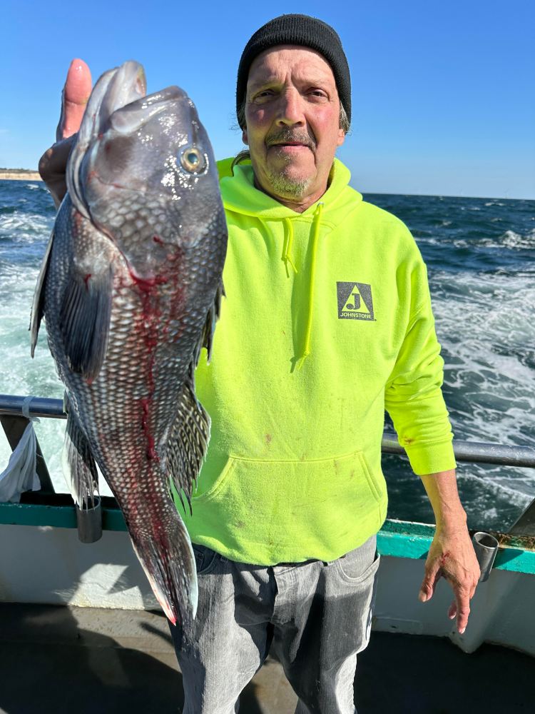 a man holding a fish