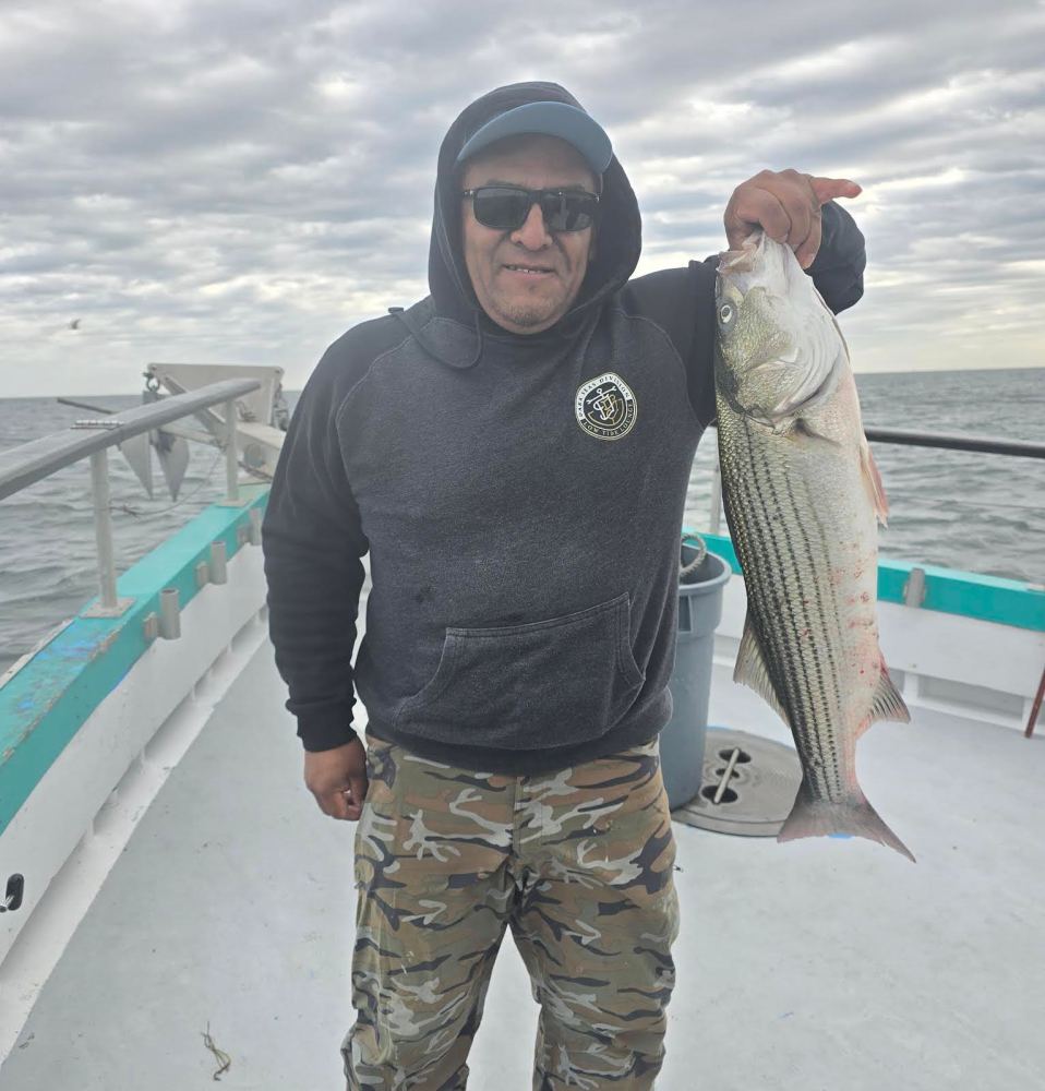 a man holding a fish