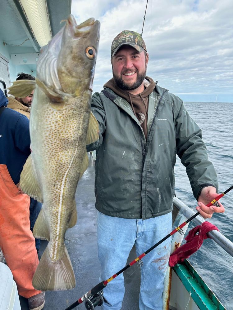 a person holding a fish