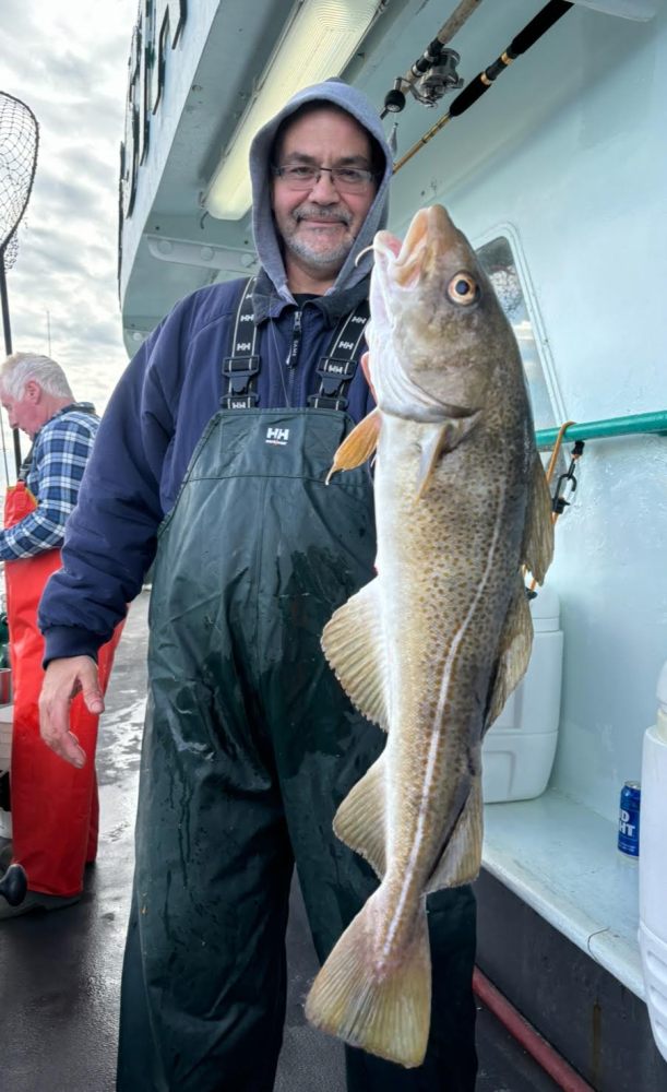 a person holding a fish