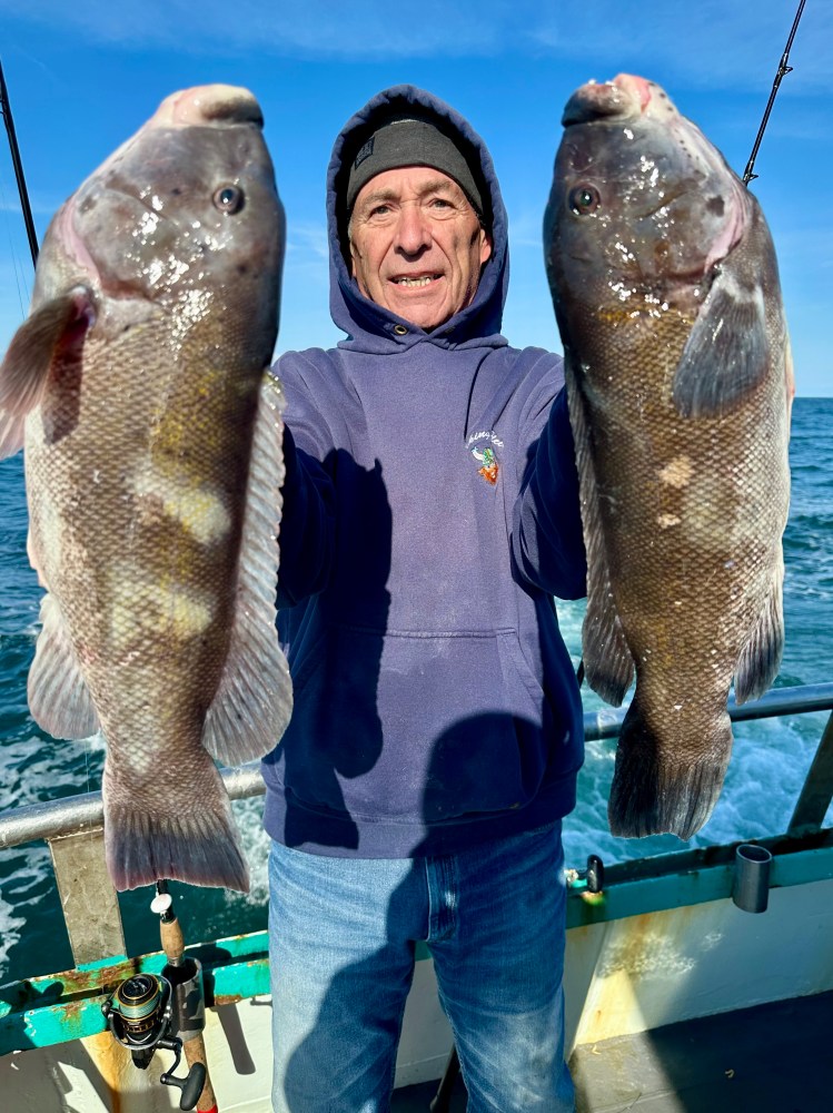 a man holding a fish