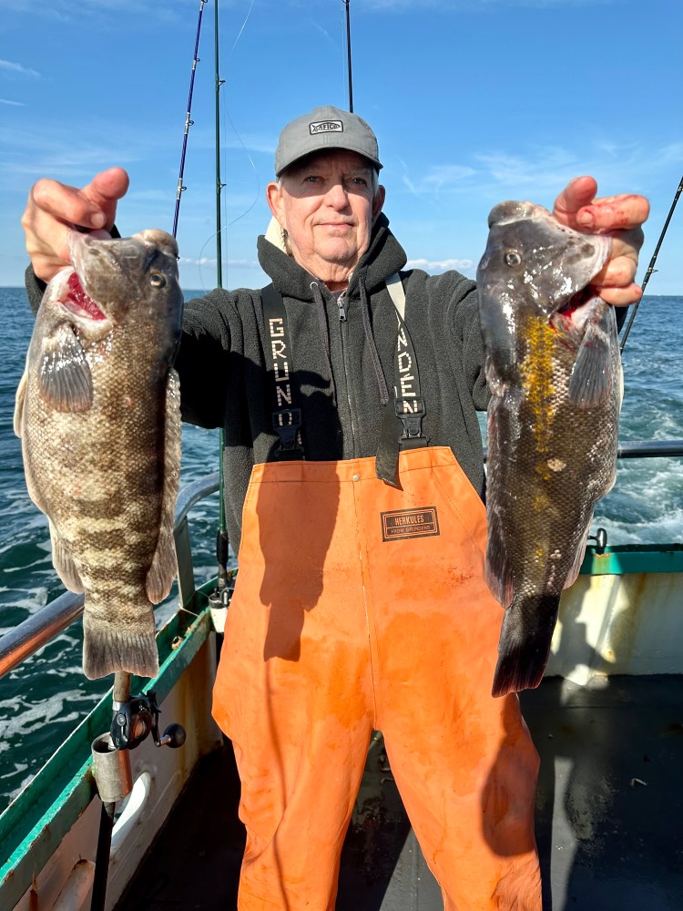 a man holding a fish