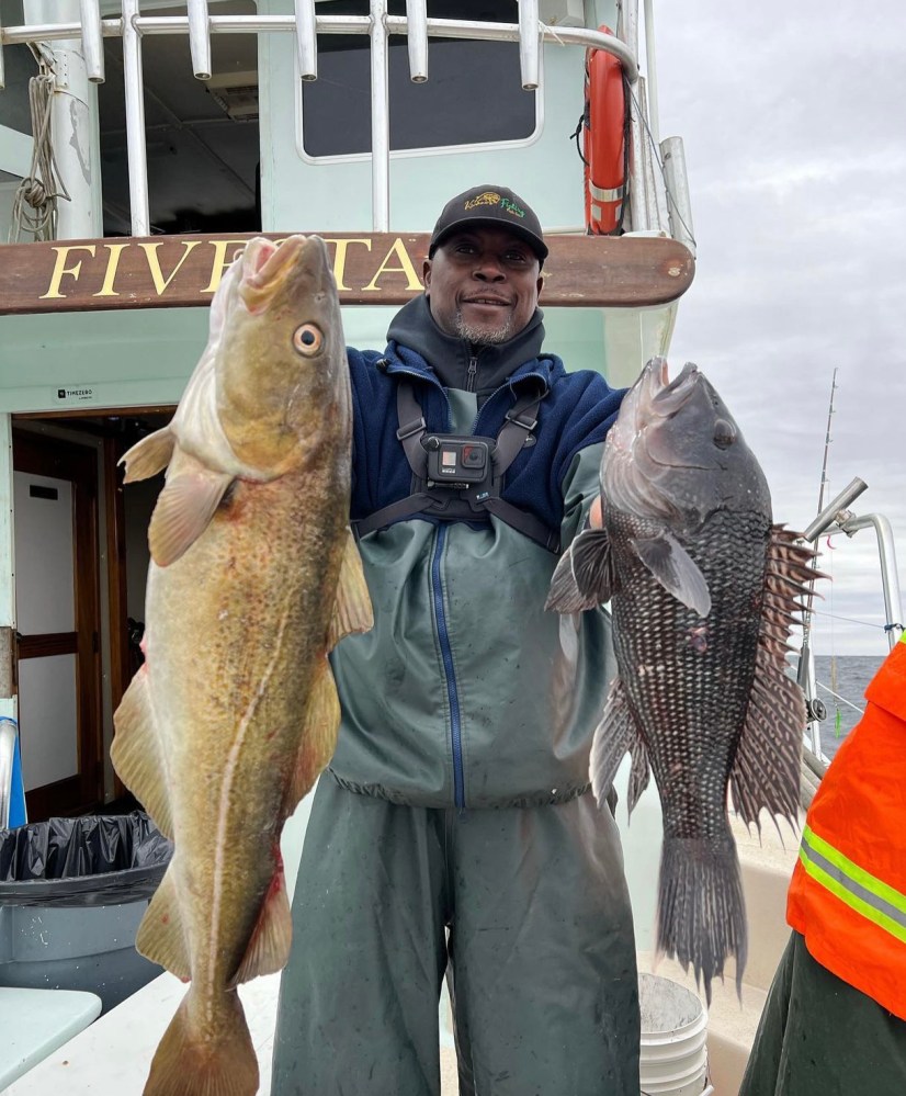 a man holding a fish