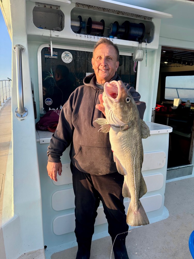 a person holding a fish