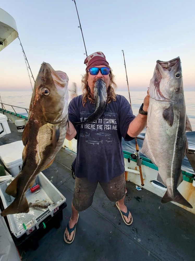 a man holding a fish