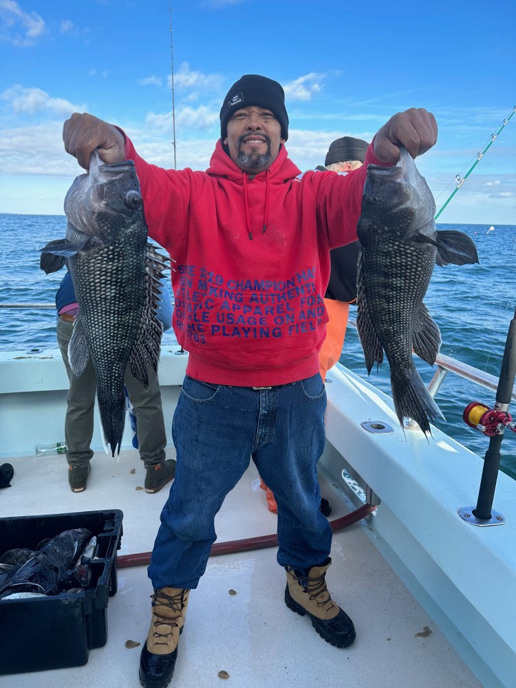 a man holding a fish