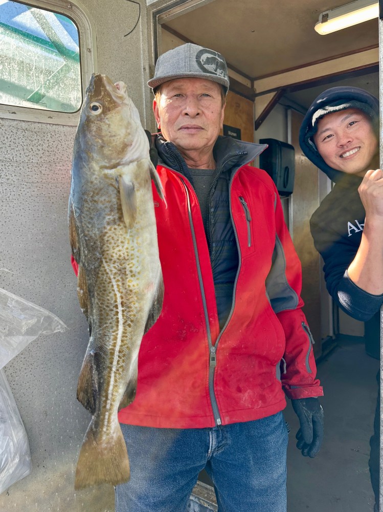 a man holding a fish