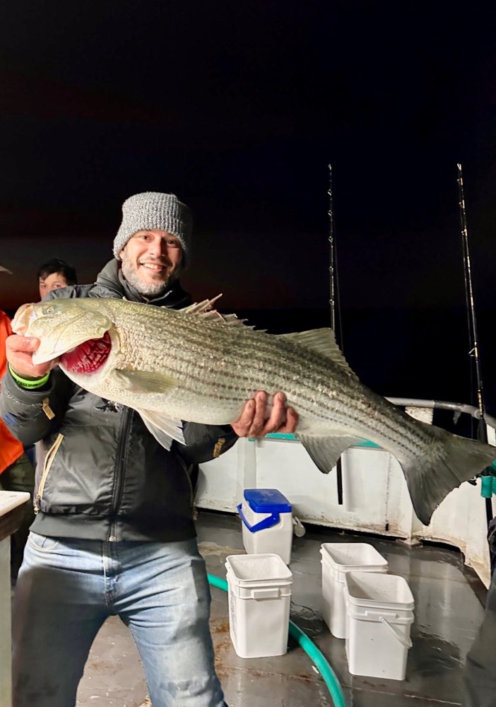 a person holding a fish