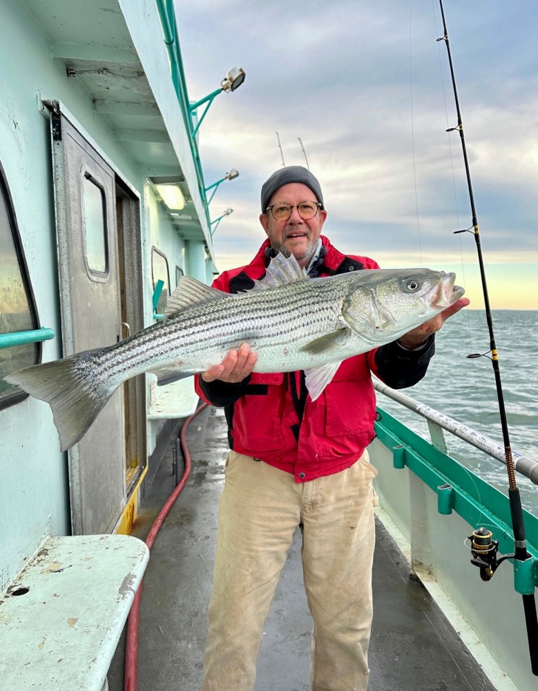 a man holding a fish