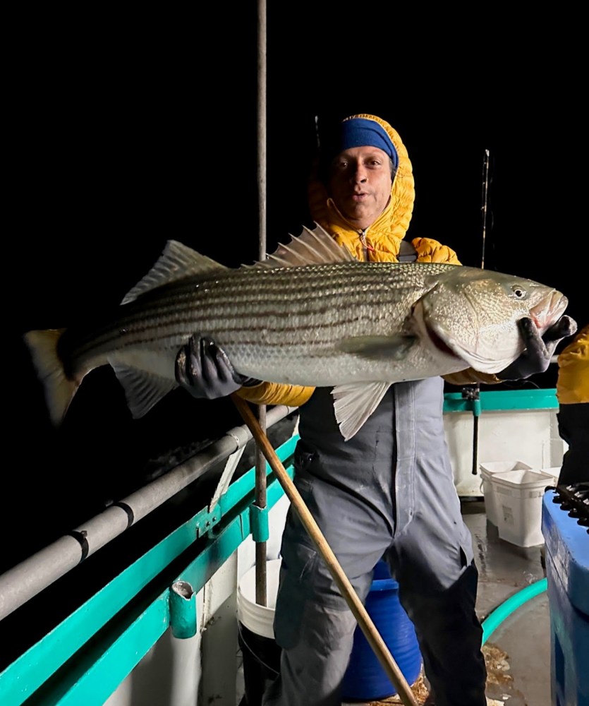 a person holding a fish