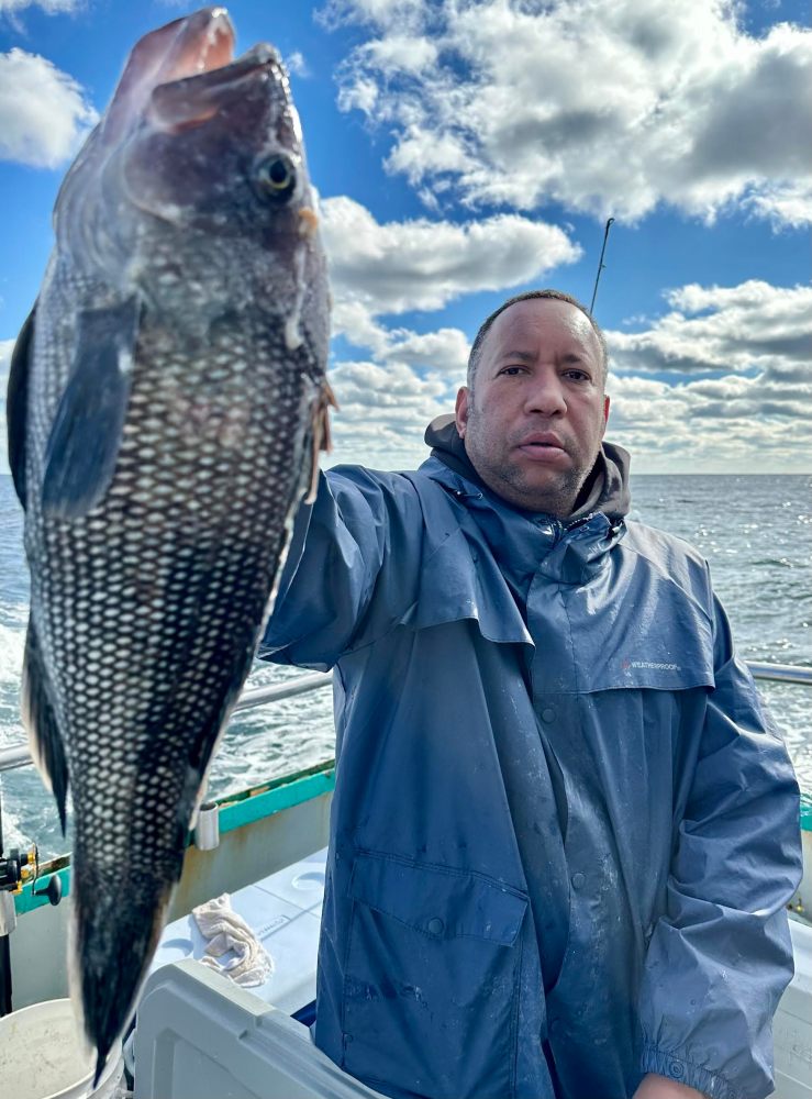 a person holding a fish