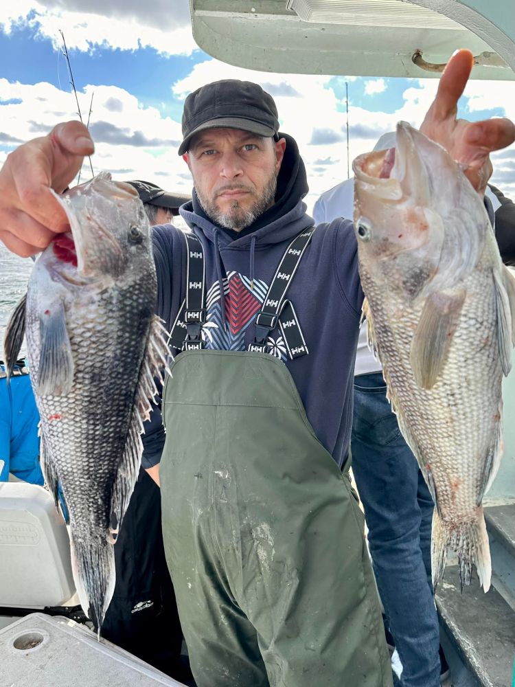 a man holding a fish