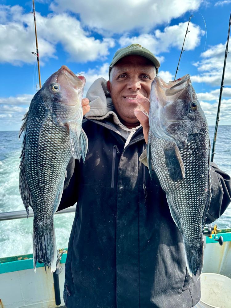 a person holding a fish