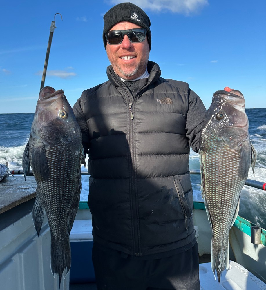 a man holding a fish