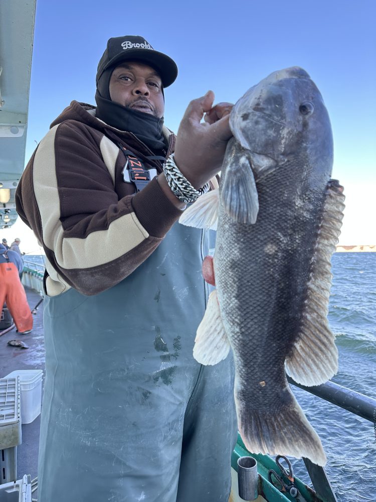 Dru Onyx holding a fish