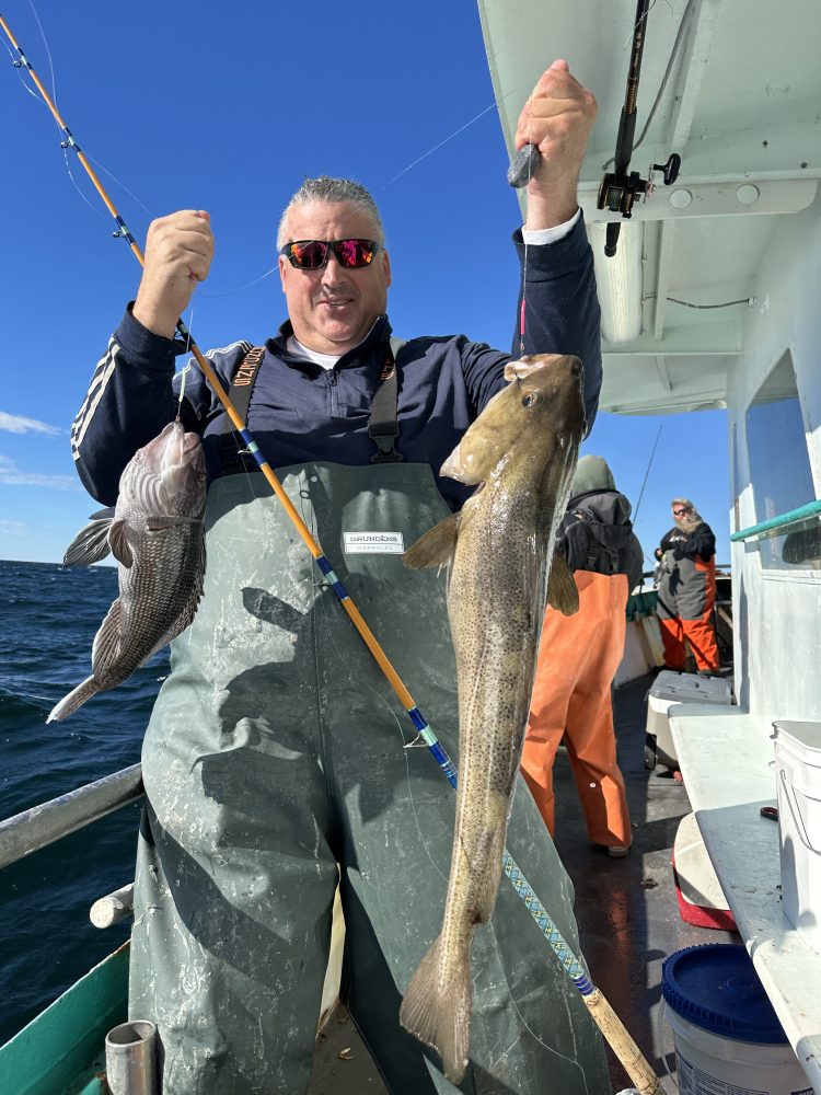 a man holding a fish