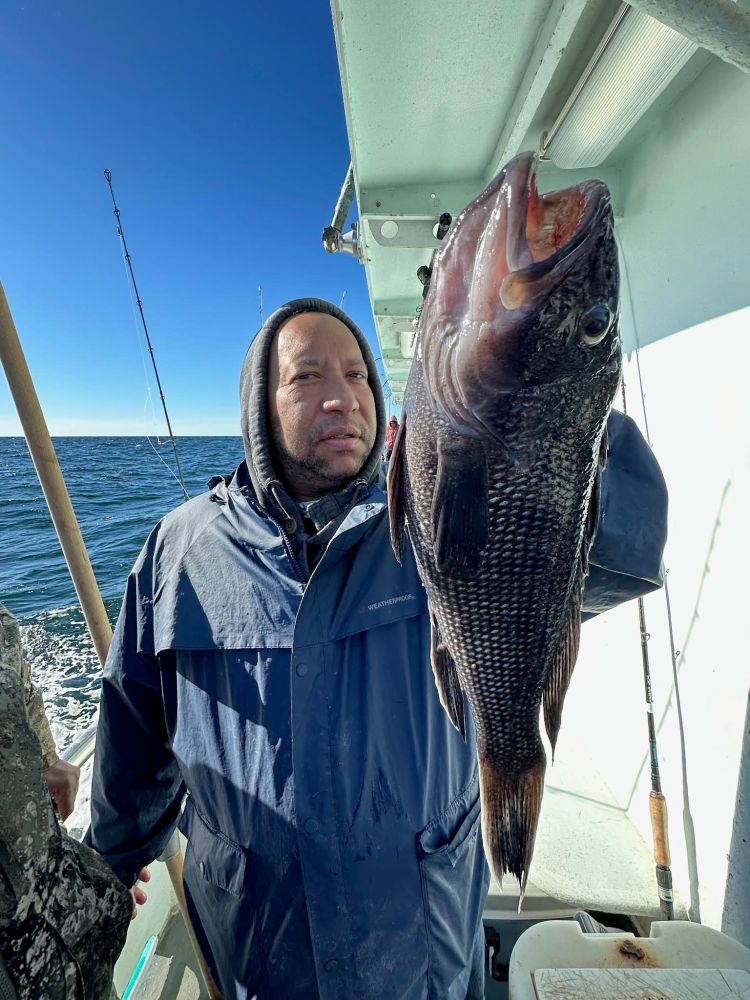 a man holding a fish