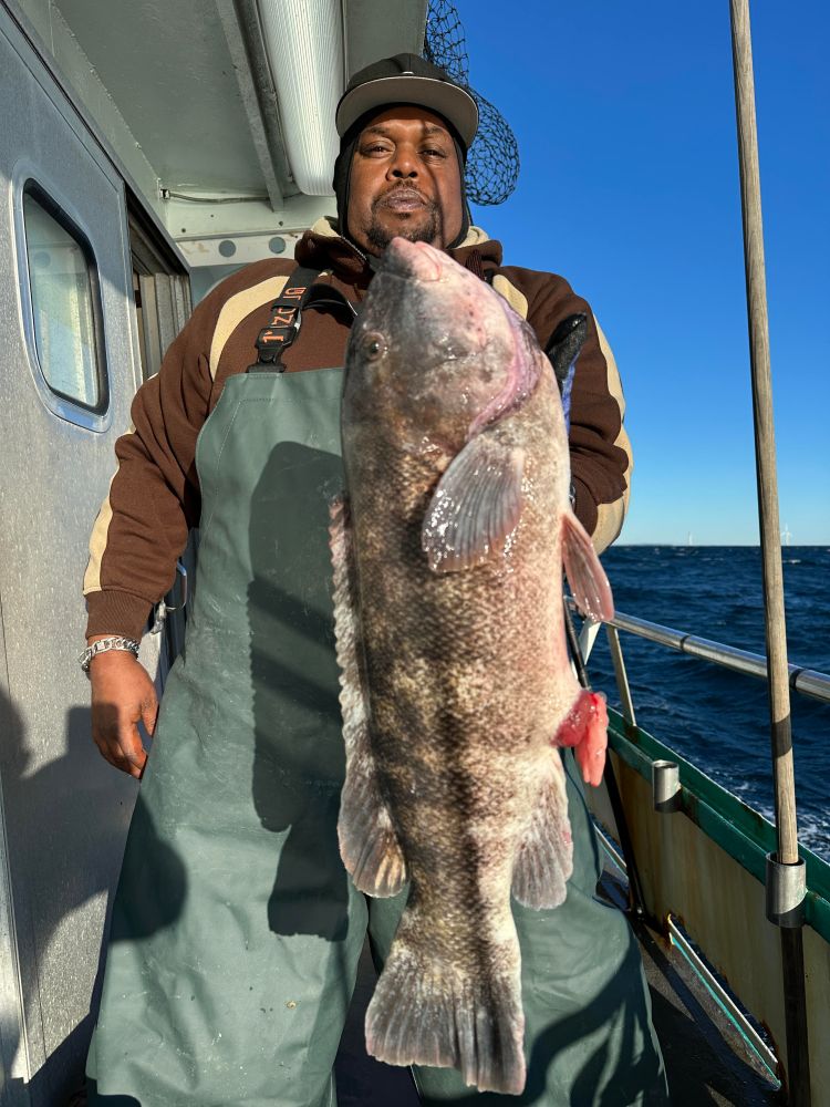 a man holding a fish