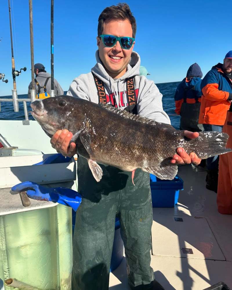 a man holding a fish