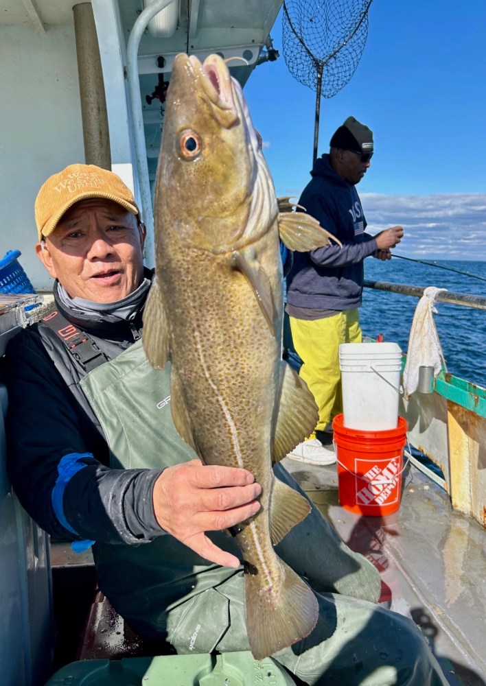 a person holding a fish