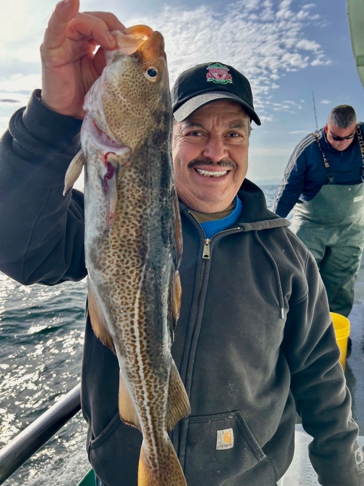 a person holding a fish