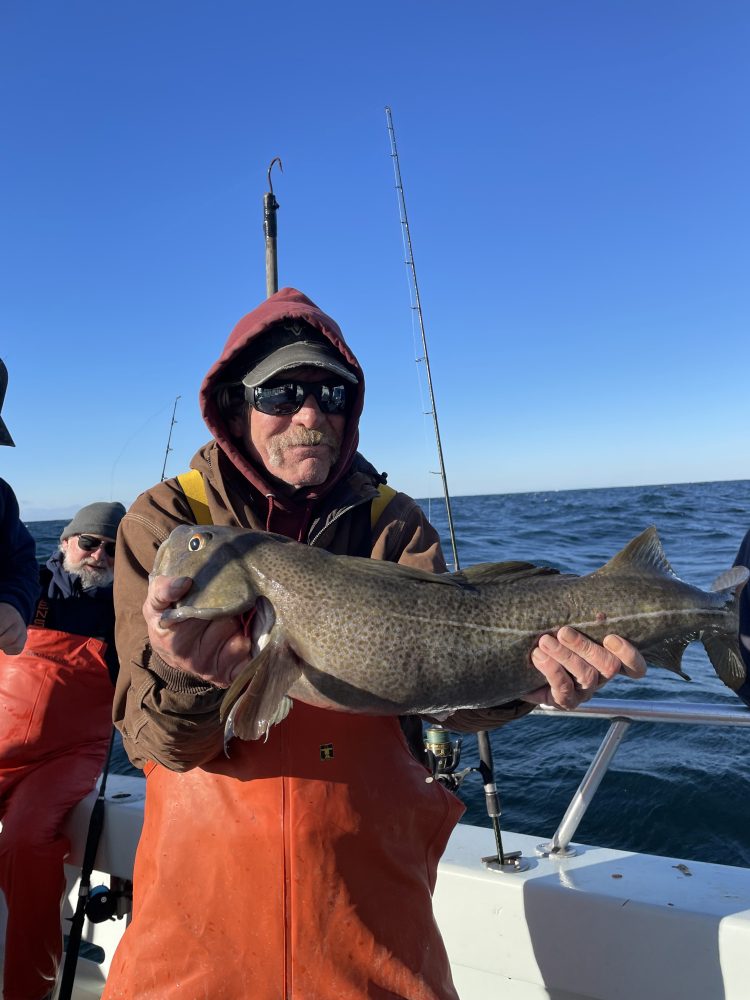 a person holding a fish