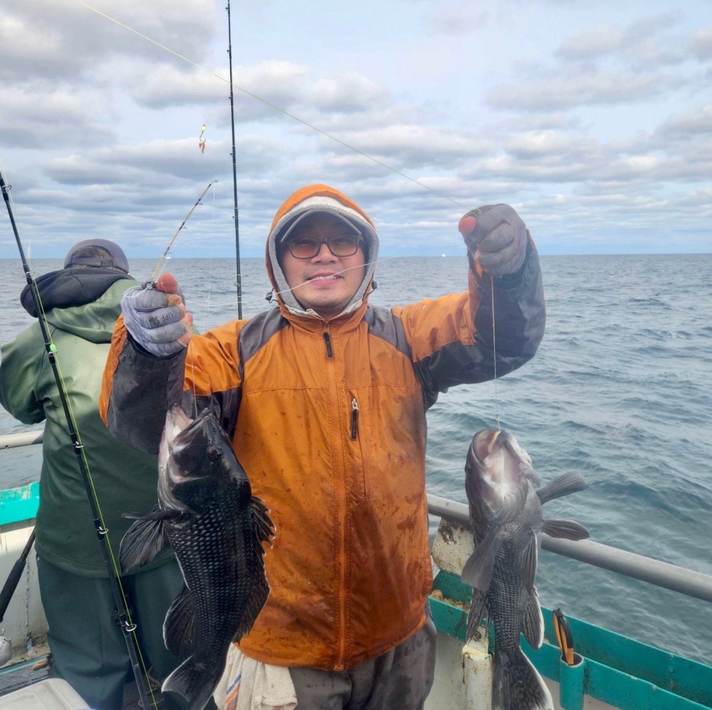 a person holding a fish in the water