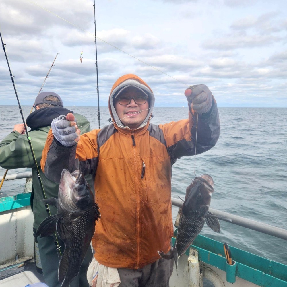 a person holding a fish in the water