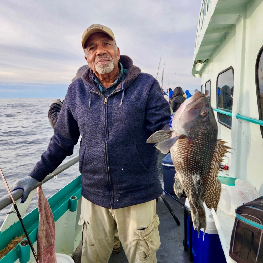 a person holding a fish