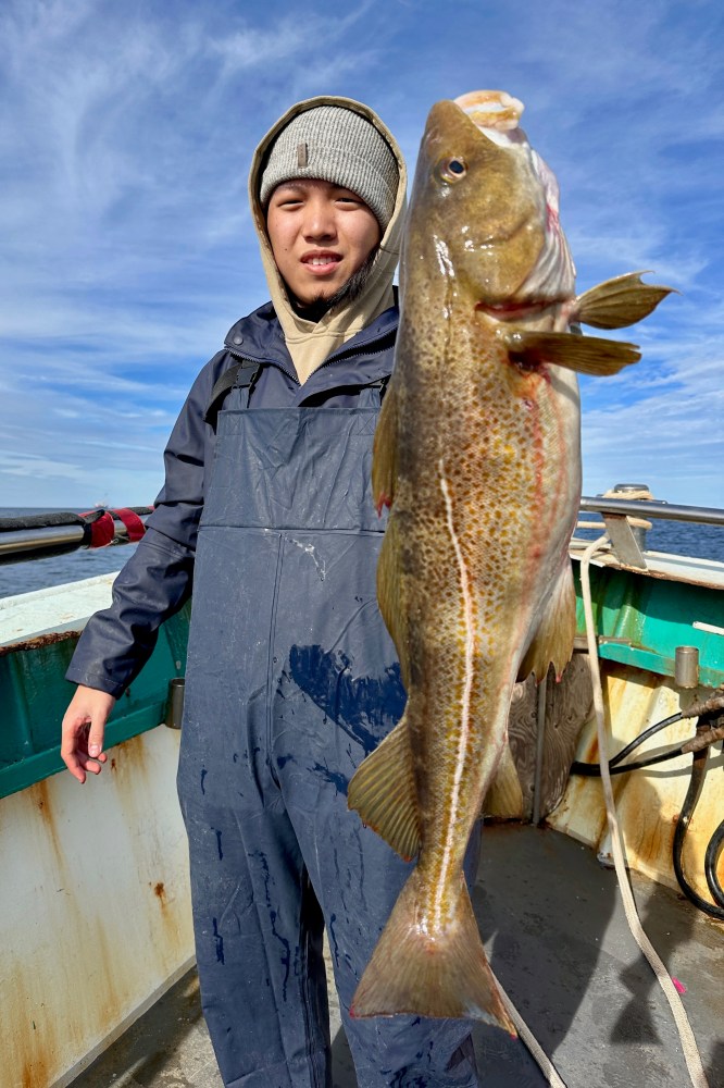 a person holding a fish