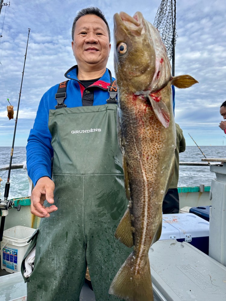 a person holding a fish