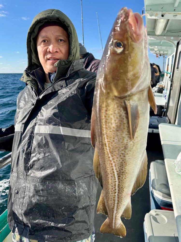 a person holding a fish