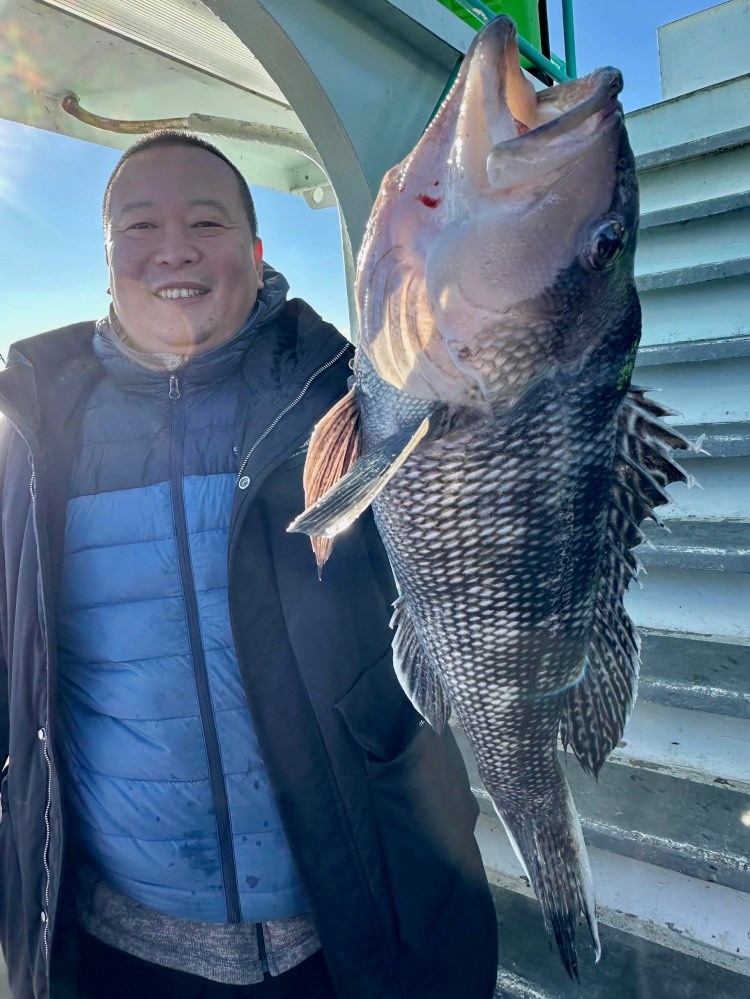 a person holding a fish