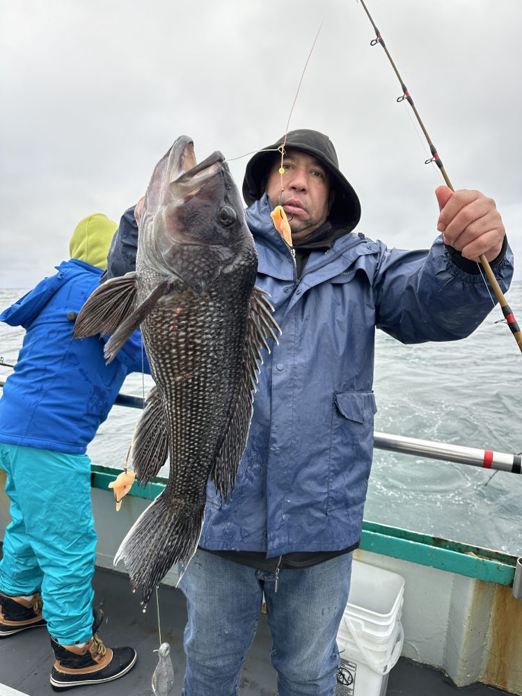 a person holding a fish