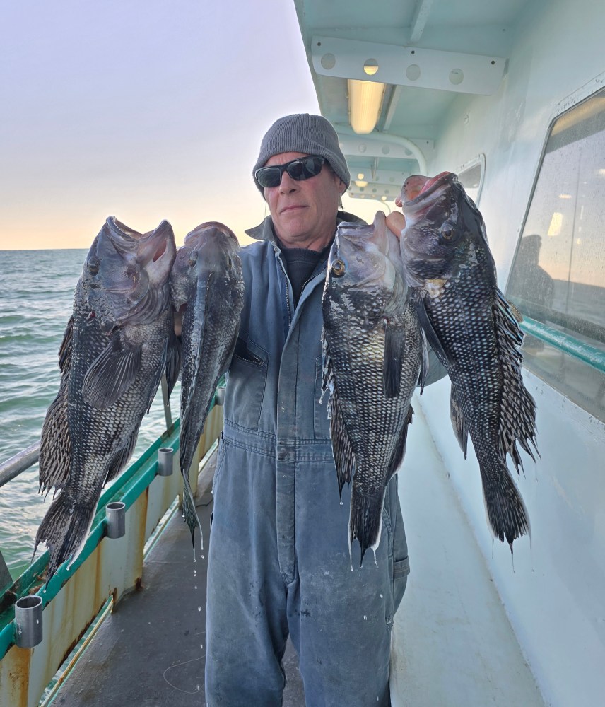 a man holding a fish