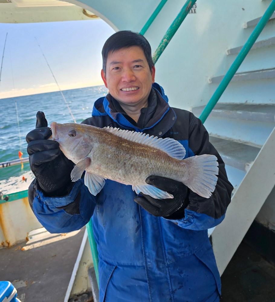 a person holding a fish