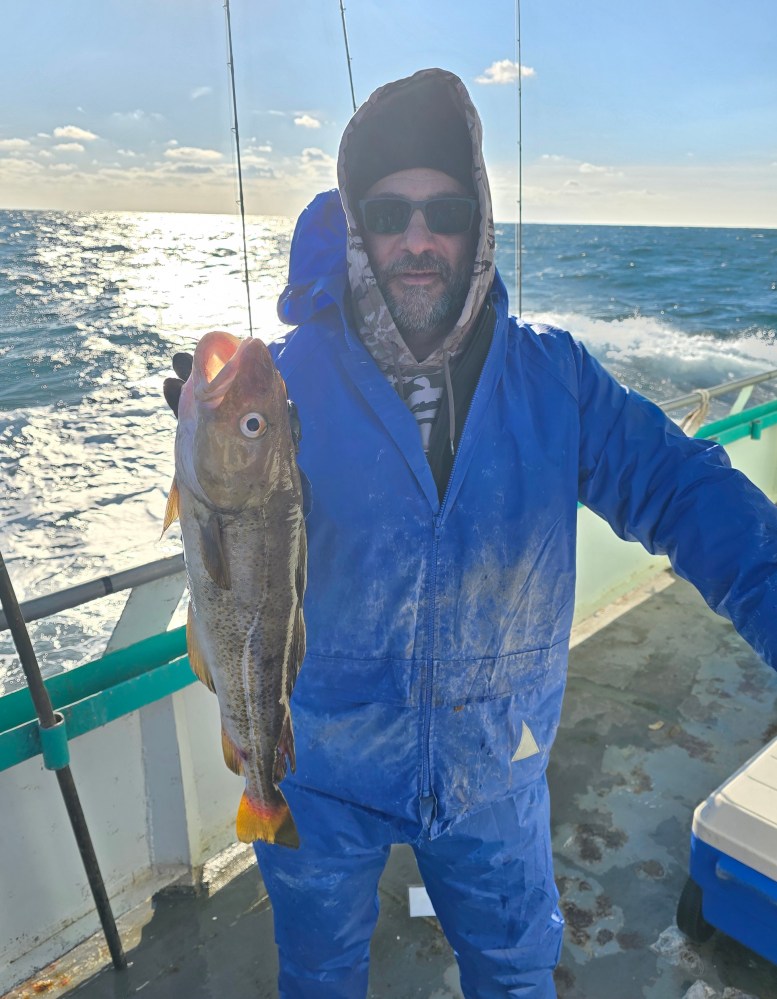 a person holding a fish