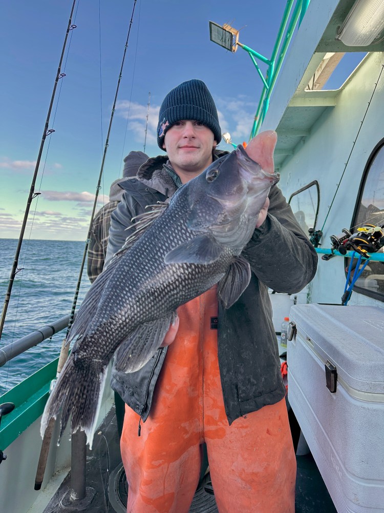 a man holding a fish