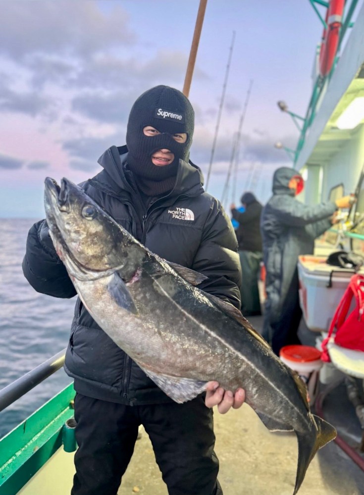 a man holding a fish