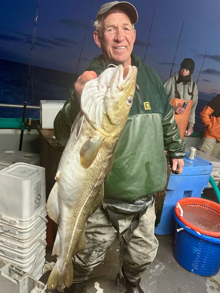 a person holding a fish