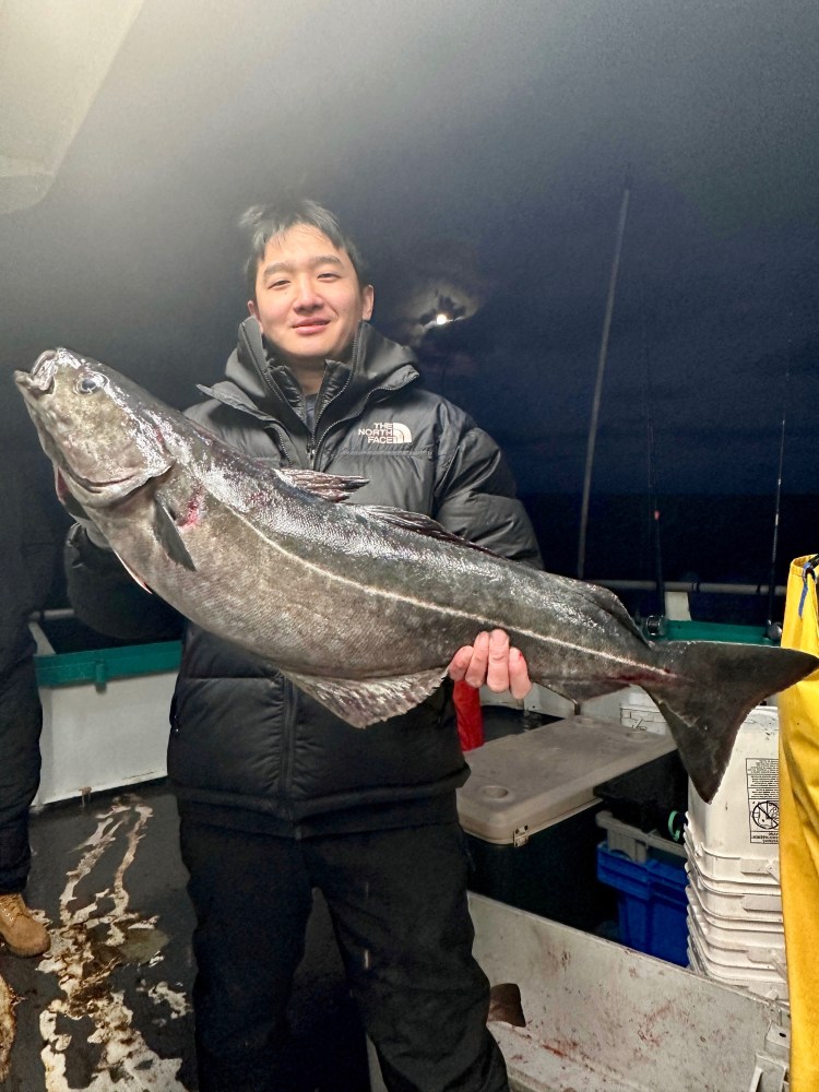 a person holding a fish